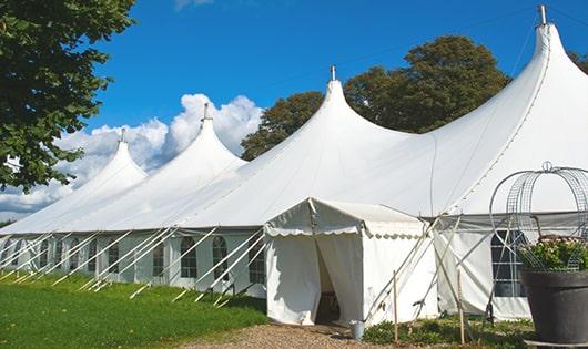 a group of luxury portable restrooms with individual stalls and running water in Woodburn